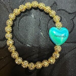 Tiffany & Co. Gold Filigree Bracelet with Teal Heart Charm